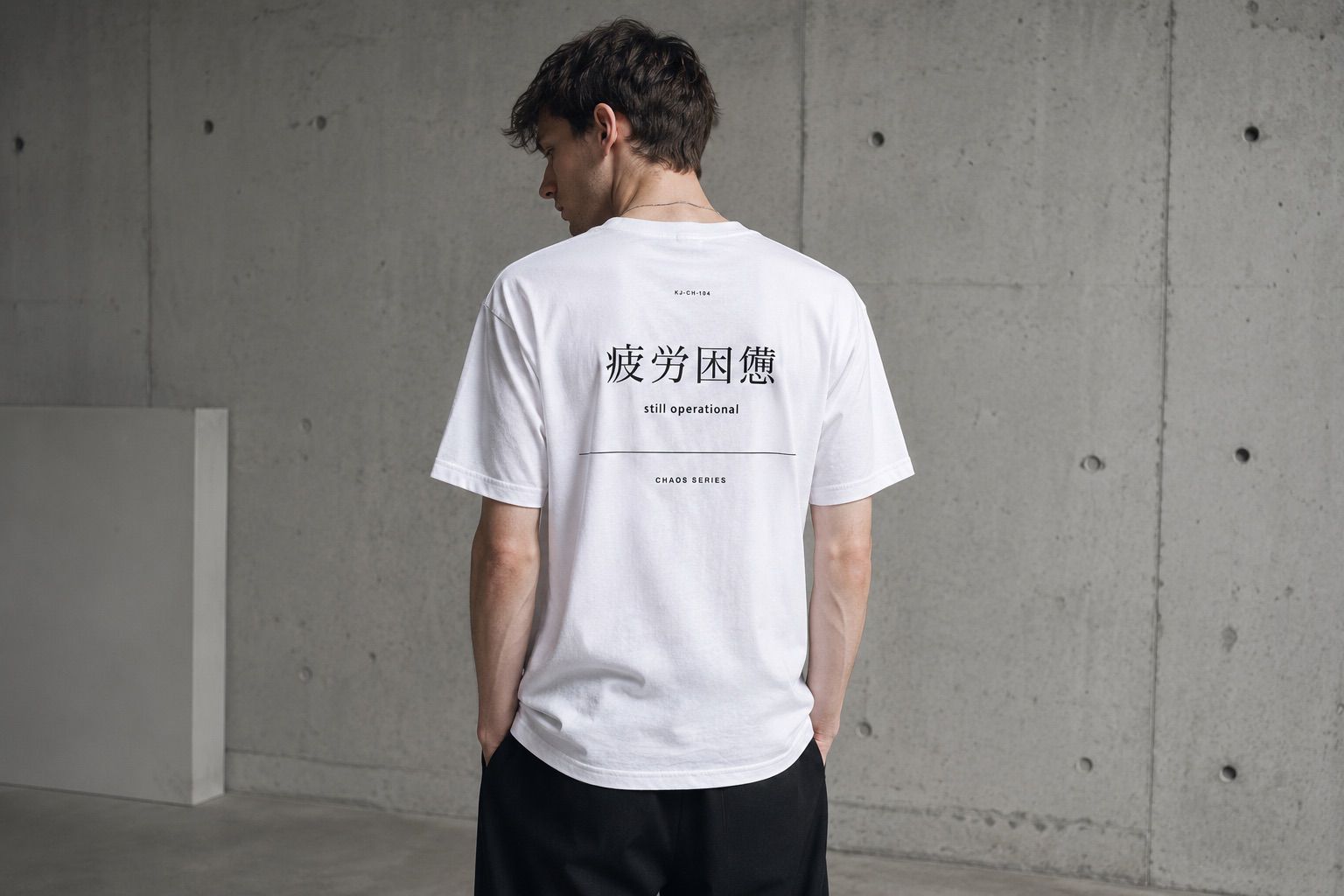 A minimalist KANJO typography T-shirt in a quiet architectural gallery.